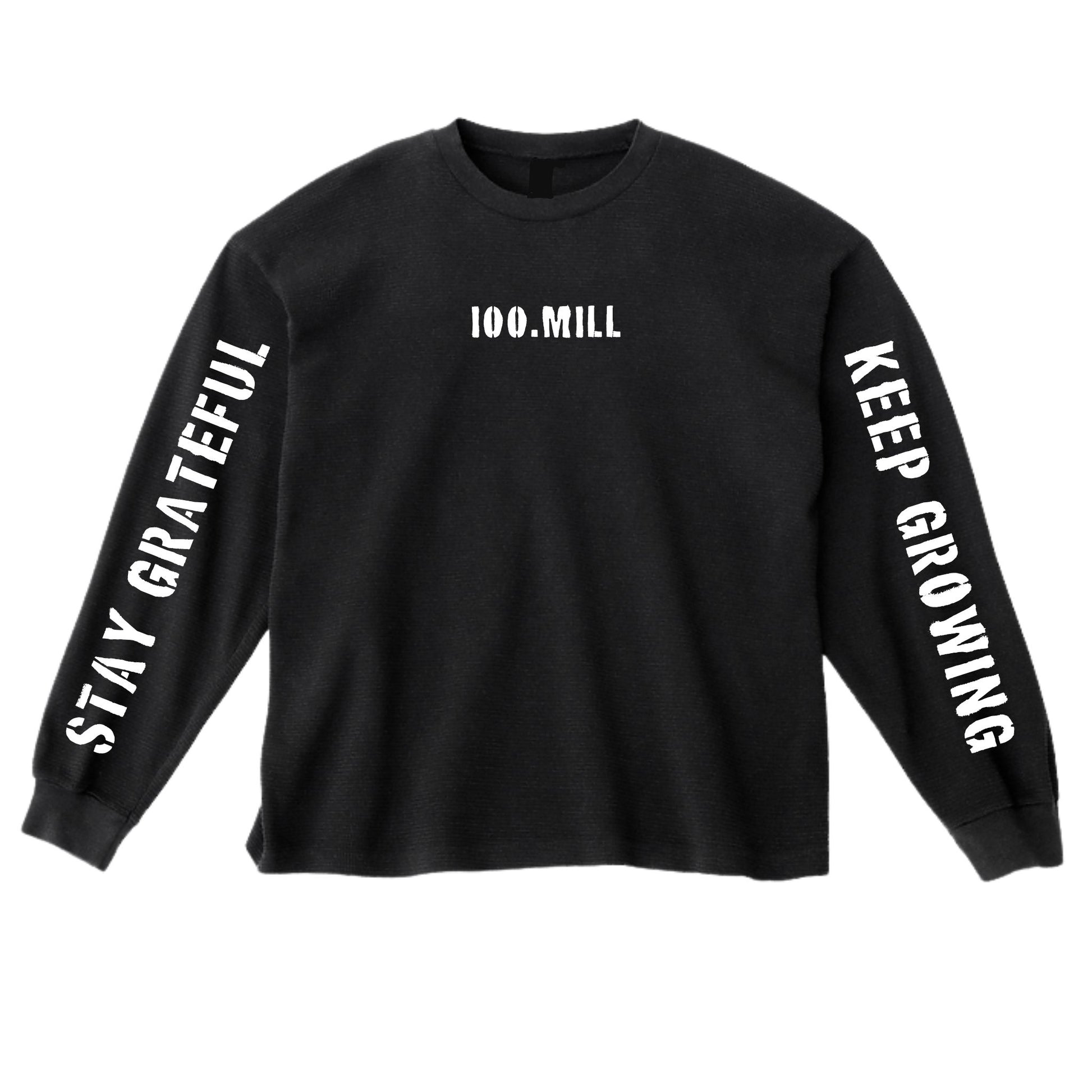 Black long-sleeve shirt with text 'Stay Grateful', '100.Mill', and 'Keep Growing' on a white background